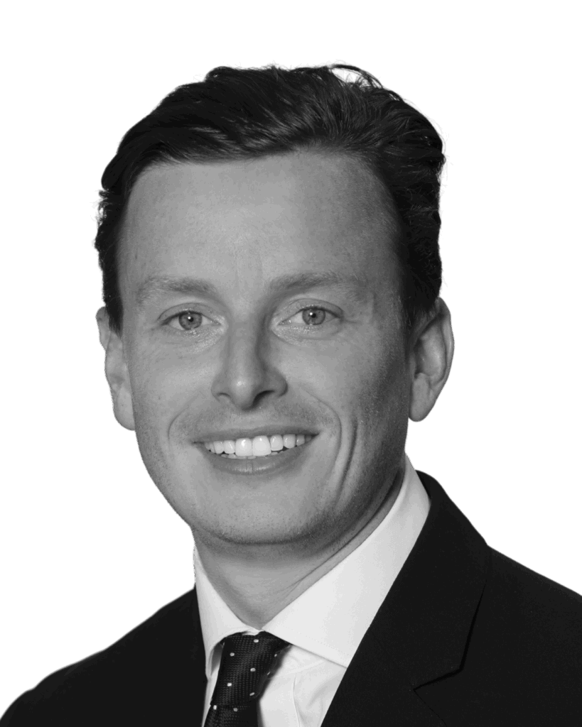 A black and white photo of tom allison
