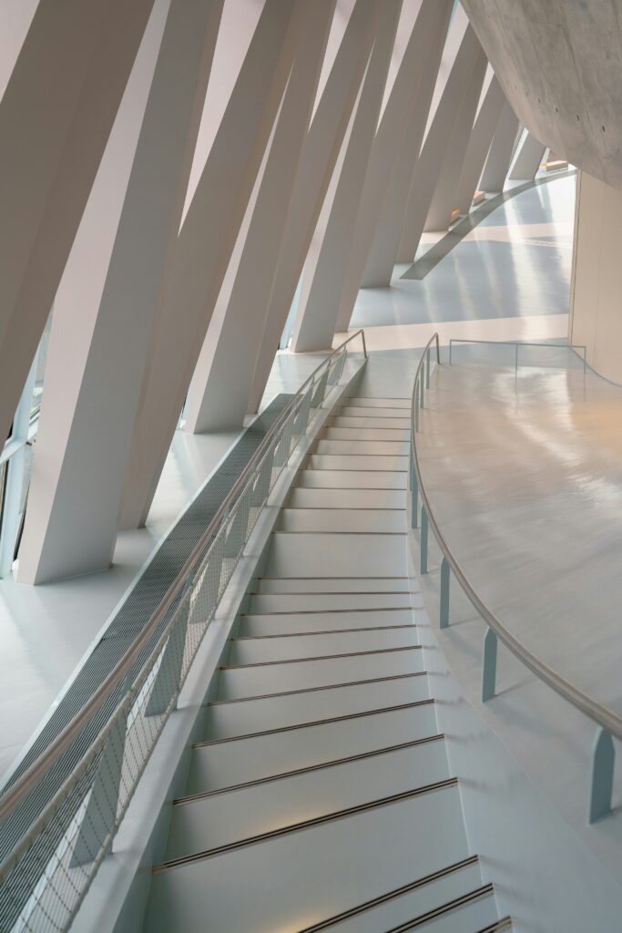 an image of a white staircase in an architectural building