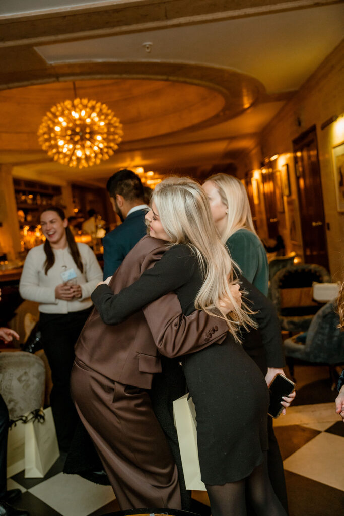 A photograph of two people hugging.