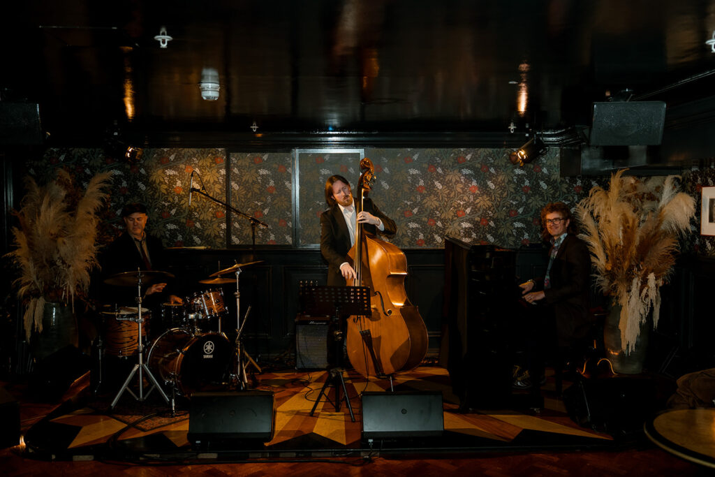 A photograph of a jazz trio playing.